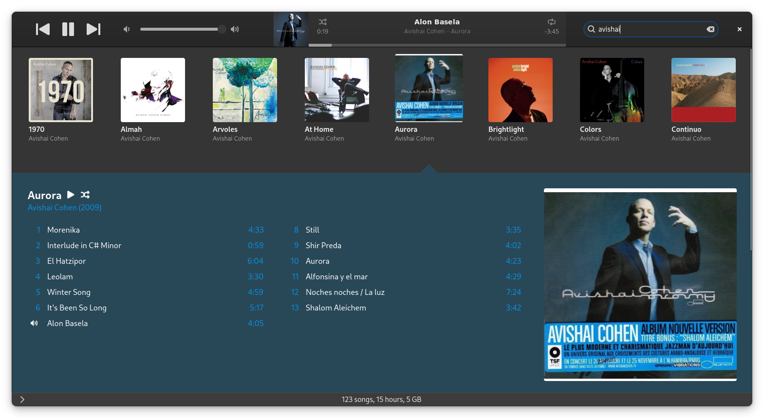 Sustain's Albums grid in dark mode: a wall of cover art with an expanded album track list.